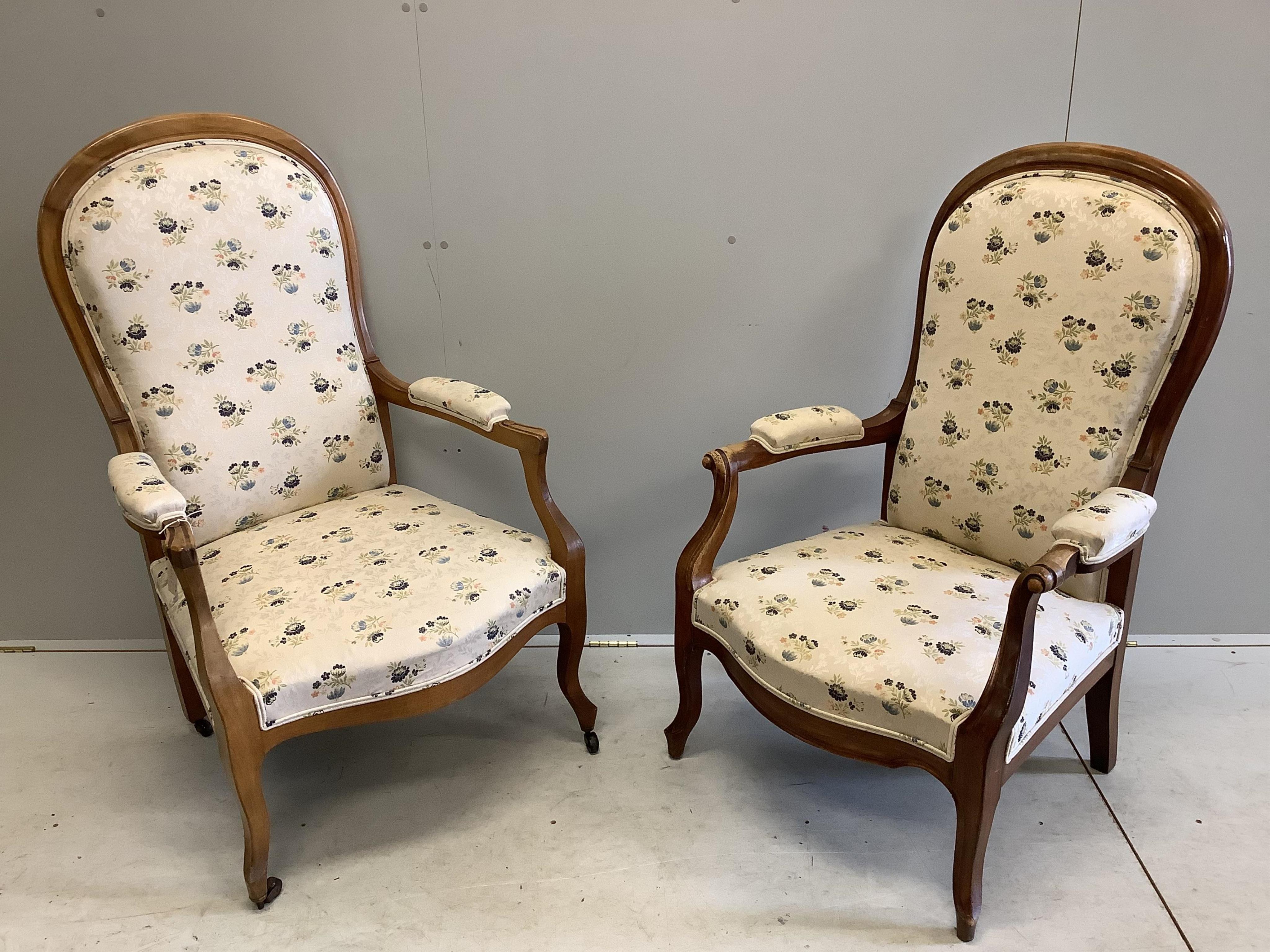 A near pair of Continental upholstered open armchairs, larger width 67cm, depth 58cm, height 114cm. Condition - fair